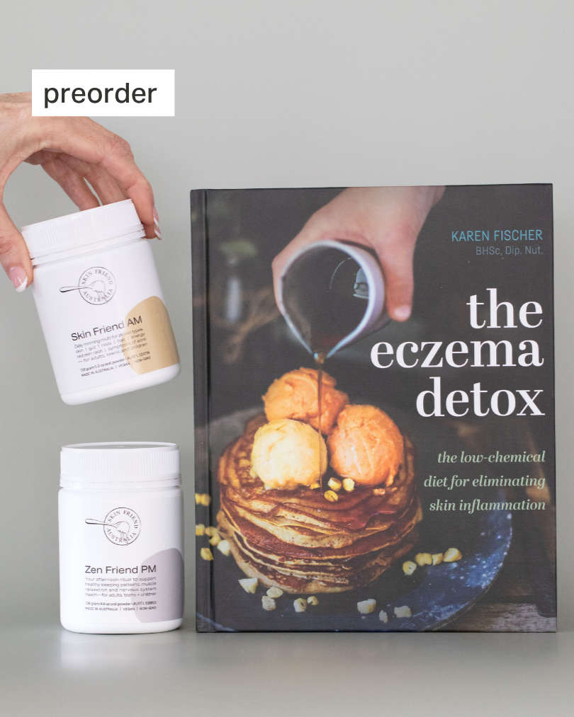 Book titled 'the eczema detox' by Karen Fischer with two white containers on a gray background.